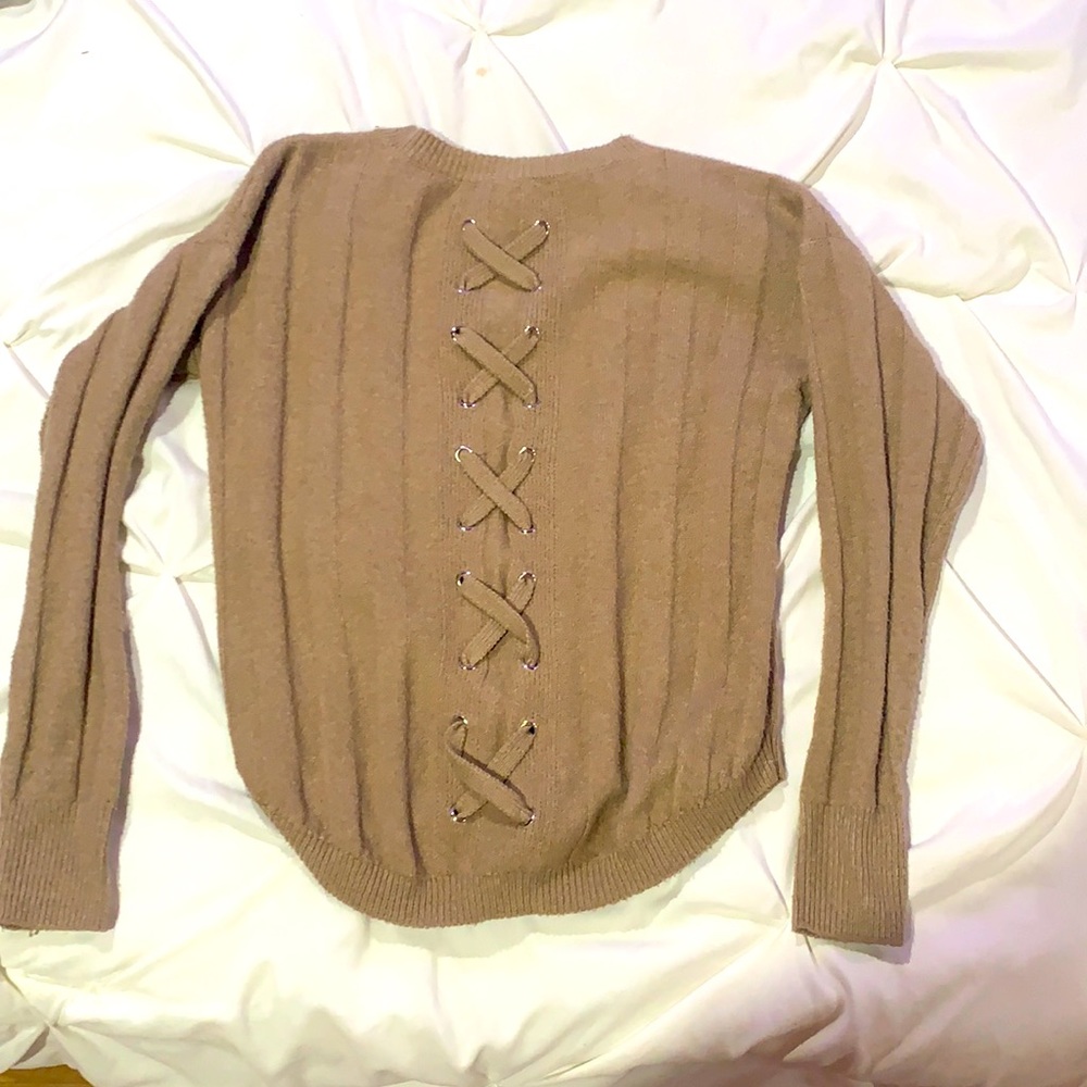 Brown/Tan sweater with cross ties on back.